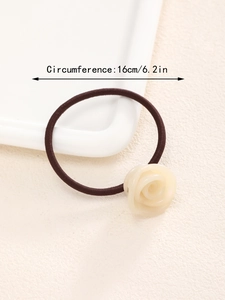 Detail view of cream rose hair tie showing circumference measurements 16cm or 6.2 inches
