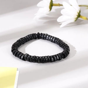 Men's black wooden bead bracelet with woven style and minimalist anchor charm accessory