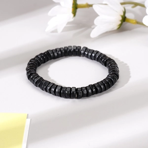 Men's handmade woven black matte beads bracelet with minimalist evil eye alloy accents