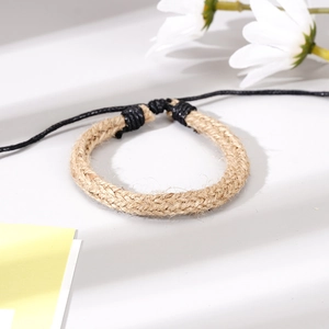 Detail of handmade braided hemp rope bracelet with adjustable knot and rustic texture