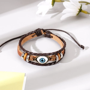 Multilayer woven leather bracelet with evil eye charm and wooden beads on white background