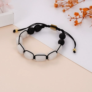 Handmade yoga bracelet featuring white barrel stones and black lava beads with gold clasp