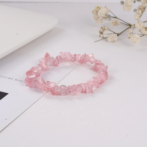 Detail showing natural pink irregular crystal stone beads on elastic bracelet band