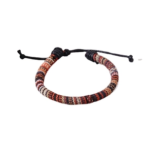 Handmade woven leather bracelet with colorful ethnic patterns and adjustable slip knot