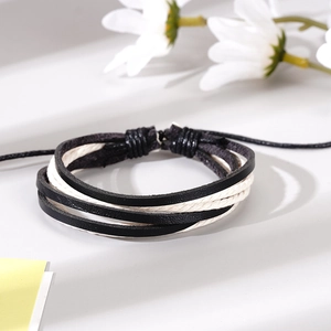 Minimalist handmade braided leather bracelet for men with adjustable cord and black finish