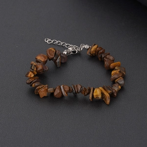 Detailed view of natural tiger eye stone chips with adjustable silver extension chain