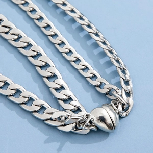 Silver multi-layer thick chain bracelet featuring a polished heart magnetic clasp