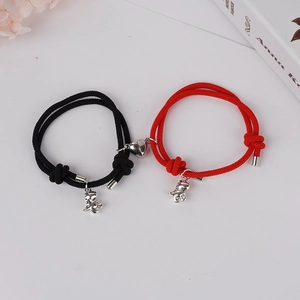 Bracelets magnétiques pour couples avec pendentifs dinosaures et fermoir cœur