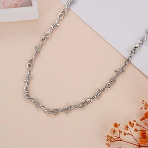 Unisex punk style silver barbed wire thorn necklace with industrial metal knot design