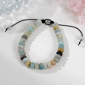 Handmade adjustable amazonite stone beaded bracelet with carved metal charm and woven cord