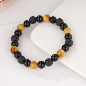 Detailed view of 8mm tiger eye, matte lava rock, and polished obsidian beaded bracelet