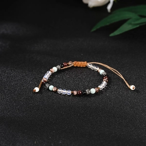 Handmade woven bohemian bracelet with multi-colored natural stone beads and adjustable cord