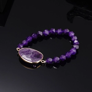 Bracciale elastico con perline di ametista e grande pietra preziosa viola in oro