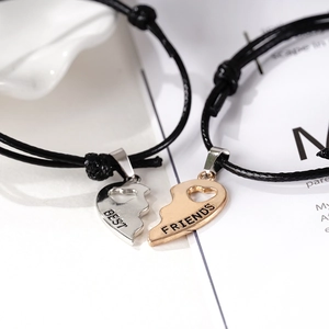 Adjustable woven black rope bracelets with interlocking gold and silver heart pendants