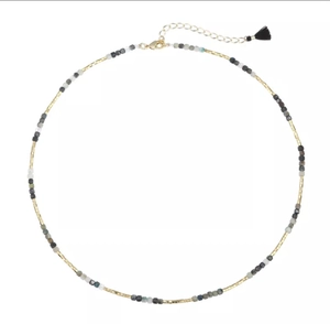 Detail of beaded tassel necklace with gold lobster clasp and extension chain