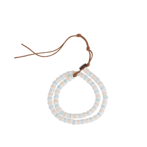 Bohemian style shell heishi bead bracelet with woven cord and button clasp for beach fashion