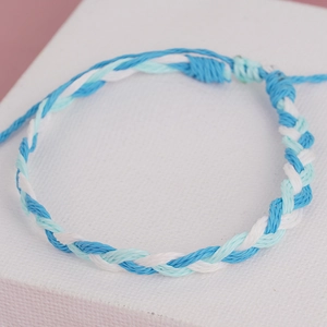 Bohemian handmade woven bracelet with adjustable blue and white tassels for beach wear