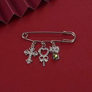 Cute silver cat waist pin brooch with heart and cross charms on red background