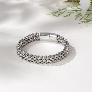 Detail of double-row square link chain bracelet with polished magnetic cylinder clasp
