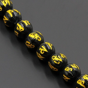 Polished black obsidian beads with gold engraved mantra symbols for DIY jewelry