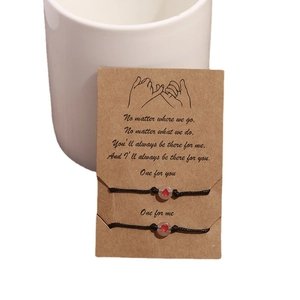 Luminous heart bead friendship bracelets with adjustable black cord on gift card