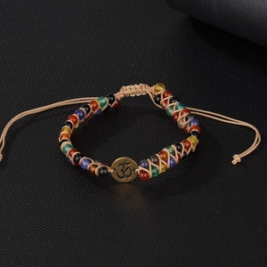 Handmade bohemian multilayered chakra bead bracelet with bronze Om symbol charm