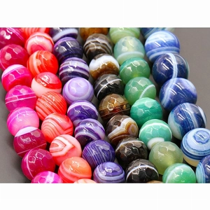 Macro shot of colorful striped faceted agate beads for DIY jewelry making