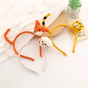 Handmade knitted animal headbands featuring cute fox, lamb, and cat designs in a set