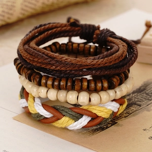 Close-up of retro 4-piece handmade woven leather and wooden bead bracelets for men