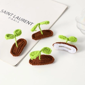 Handmade 4-piece sprout hair clip set with green leaves and brown base on metal BB clips