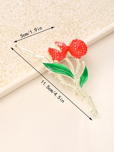 Pince à cheveux cerise rouge avec feuilles vertes et design de branche argentée