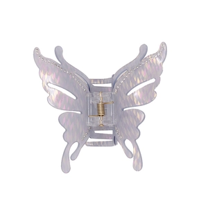 Pince à cheveux papillon irisée violette avec détails en strass et fini brillant
