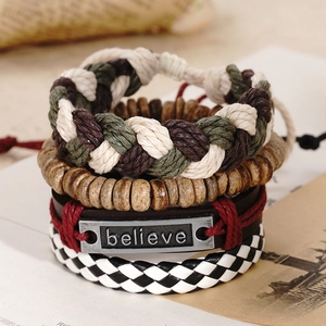 Close-up of a 4-piece vintage layered bracelet set with leather and wood beads