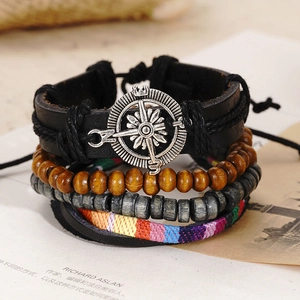 Detail view of handmade multilayer leather bracelet with compass charm and wooden beads