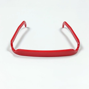 Flat lay of a red square headband made of polished plastic on a white background