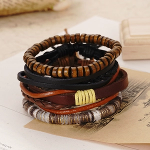 Detailed view of handmade leather bracelets set with wood beads and vintage textures