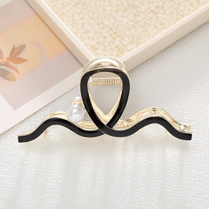 Elegant gold metal hair claw with black enamel waves and white pearls for women