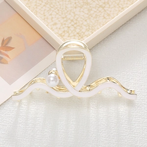 Elegant wavy metal claw clip with white enamel finish and pearl accents for women