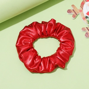 Bright red mermaid sequin scrunchie with metallic finish for Christmas hair styling