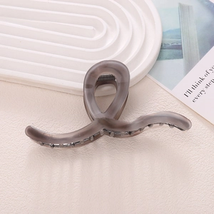 Large tortoiseshell acetate shark hair claw clip in translucent taupe for women hairstyle