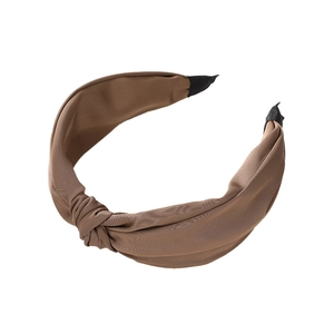 Brown wide-brimmed knotted headband in soft fabric for women with a vintage French style