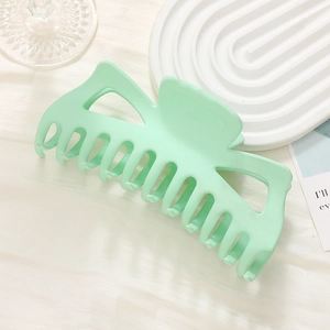 Oversized matte mint green shark hair claw clip for elegant updo hairstyling