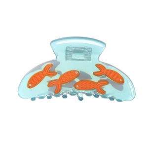 Blue translucent fish claw clip hair accessory with orange goldfish patterns