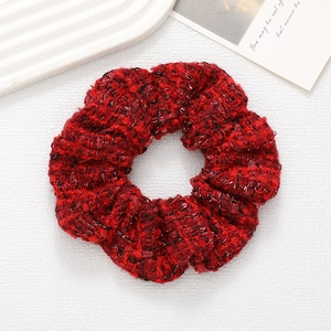 Thick tweed hair scrunchie in vibrant red with silver silk thread for elegant bun styles
