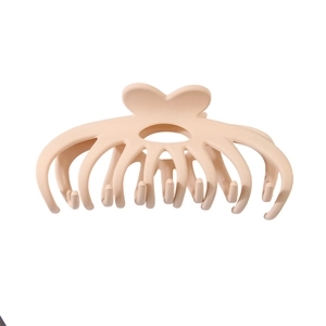 Detailed view of large matte pink octopus hair claw clip with strong grip for styling