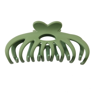 Macro view of large sage green matte claw clip showing durable octopus tooth structure