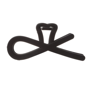 Matte black hollow geometric hair claw clip with asymmetric cross design on white backdrop