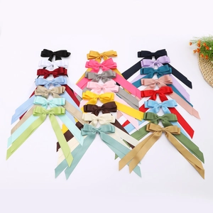 Set of colorful satin double bow hair clips with long ribbons in multiple vibrant colors