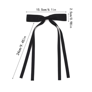Elegant black ribbon bow hair clip with long streamers and fine woven texture
