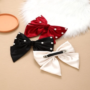 Three-piece satin bow hair clips set with pearls in red black and beige colors